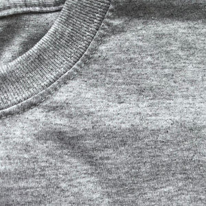 Close up of the grey marl t-shirt fabric.