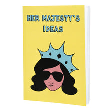 Load image into Gallery viewer, Photo of Her Majesty’s Ideas notebook, featuring a yellow cover with the title in blue and a stylised illustration of an unsmiling woman with long black hair, wearing sunglasses and an extravagant blue crown.