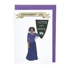 Load image into Gallery viewer, Photo of a greetings card depicting a suffragette in a headscarf and a purple top and skirt, holding a pennant that reads “Votes For Women” with an elephant at the base. Above is a banner reading &quot;Independent Chick&quot; and the background is white. Behind the card is a purple envelope.