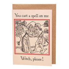 Load image into Gallery viewer, Photograph of a white card on a brown envelope. The card features a mediaeval woodcut design of two peasants embracing next to a tree, with a village on a hill in the background. Above in a black Gothic font are the words &quot;You cast a spell on me” and below are the words “Witch, please!”.