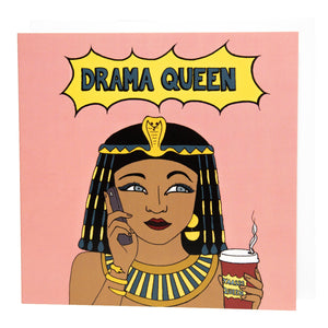 Photo of a large square pink greetings card featuring a comic book style illustration of Cleopatra on her mobile phone and holding a take-away coffee, with 'Drama Queen' written in a flash above her.