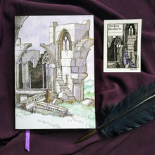 Load image into Gallery viewer, Photo of the Jane Eyre bookplate, which illustrates gothic windows and stairs and “I am no bird and no net ensnares me” carved into the wall. A raven sits on a broken pillar. In the top left is a space to write starting with “This Book Belongs To…”. The bookplate is pictured next to the Thornfield Hall notebook, depicting a crumbling Gothic ruin with a purple ribbon emerging from the pages, and a black quill.